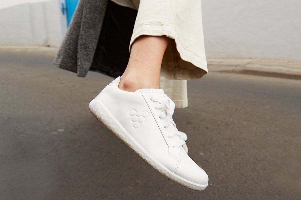 Picture of white vivobarefoot shoe on foot